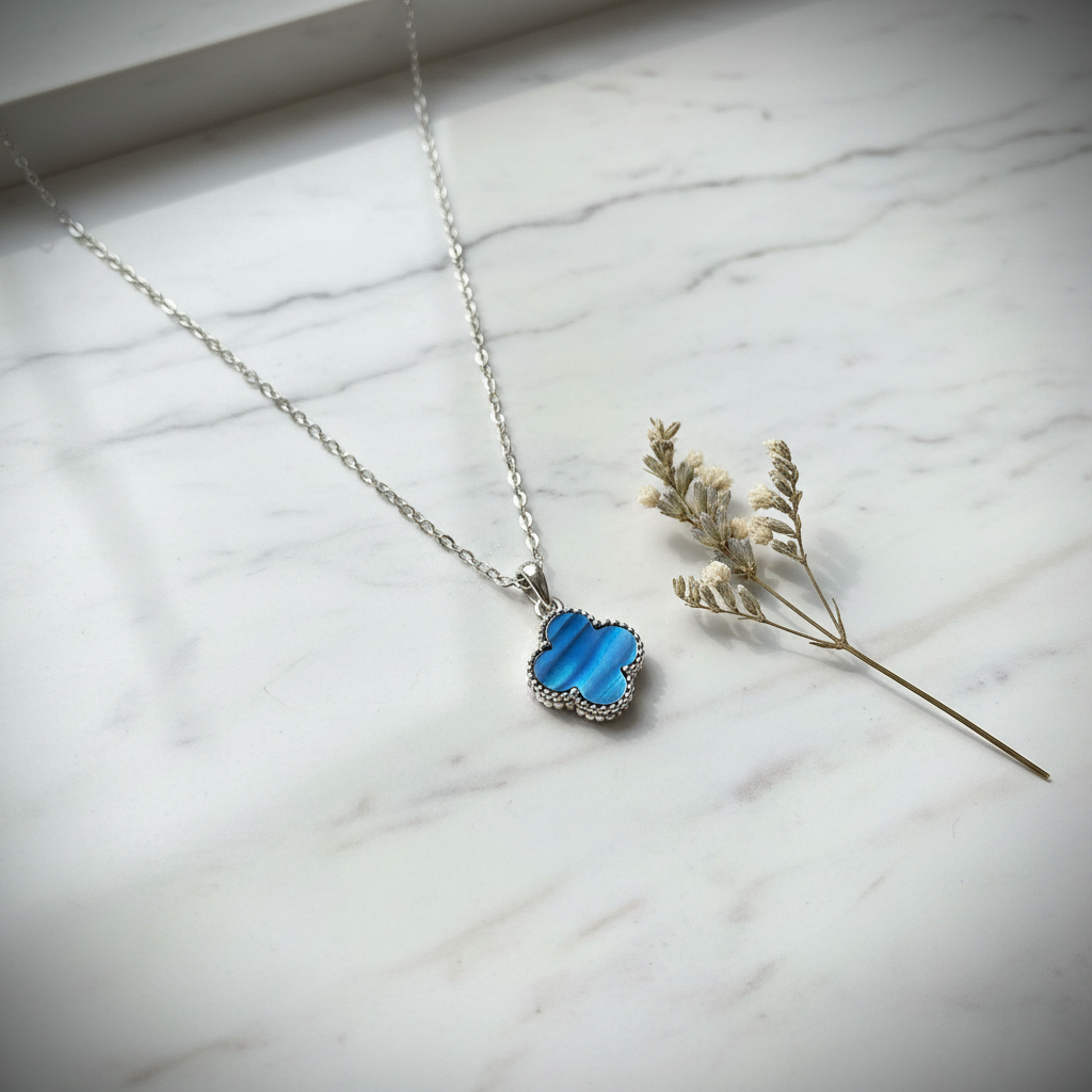 Blue Clover Necklace on Marble