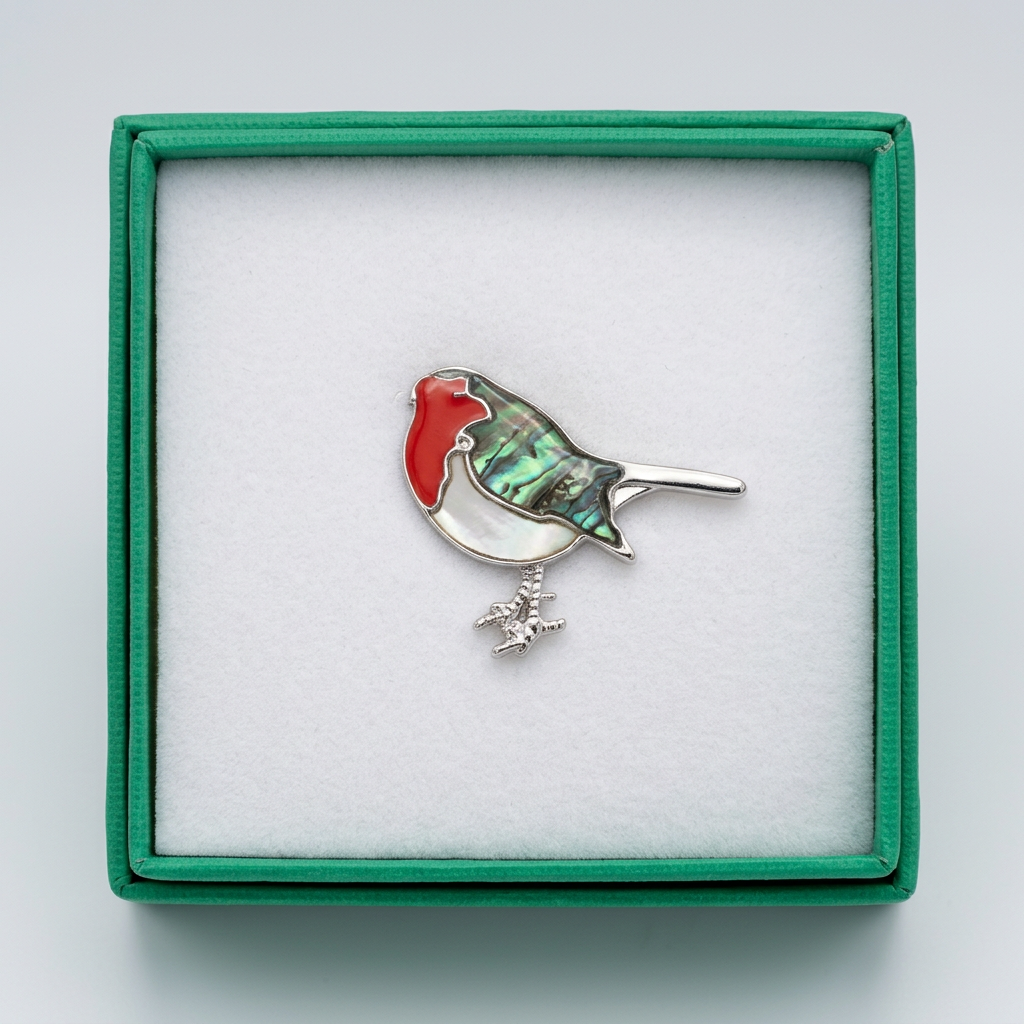 Clearer photo of the robin pin badge in its green presentation box