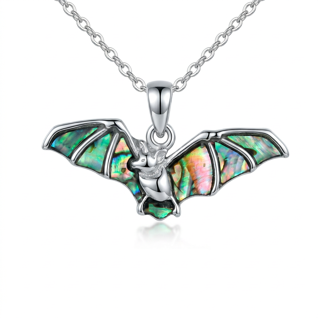 Paua shell bat necklace on a white background
