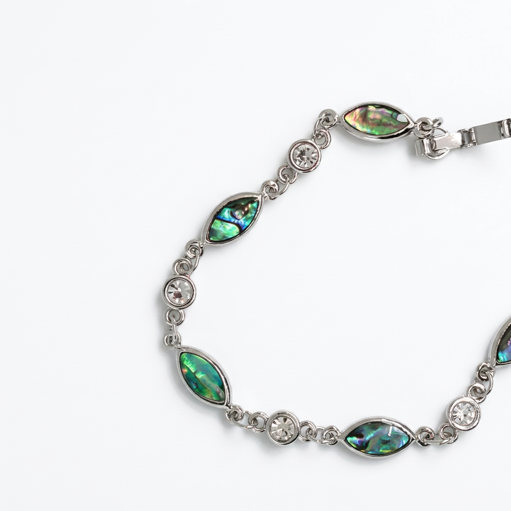 Paua shell bracelet on a clean white background