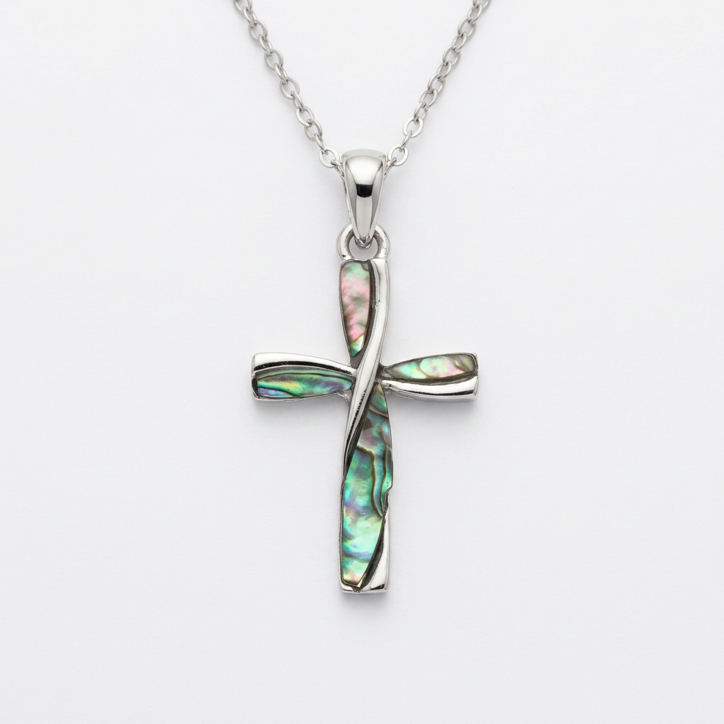Paua shell cross necklace on a clean white background