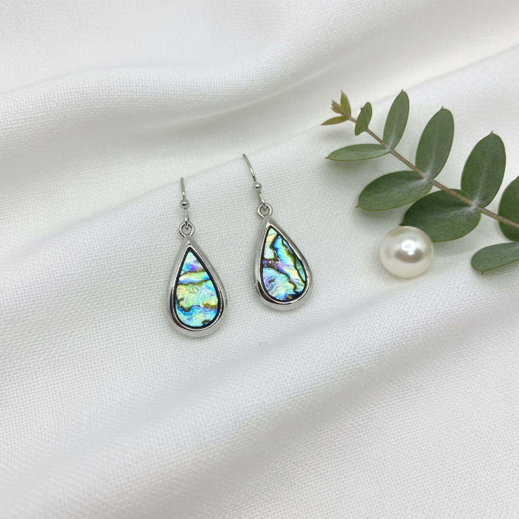 Paua Shell Teardrop Earrings on White Linen