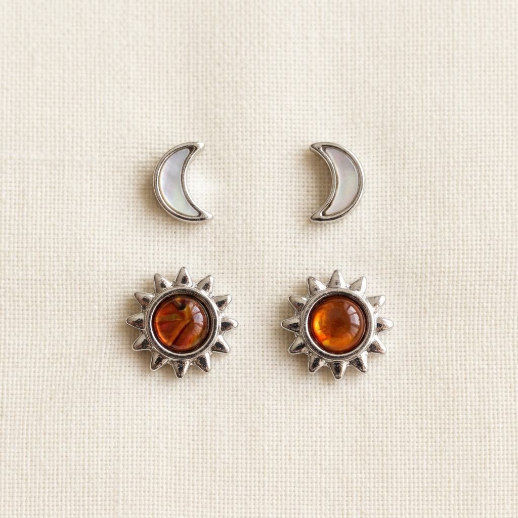 Sun and moon shell stud earrings on classic ivory linen