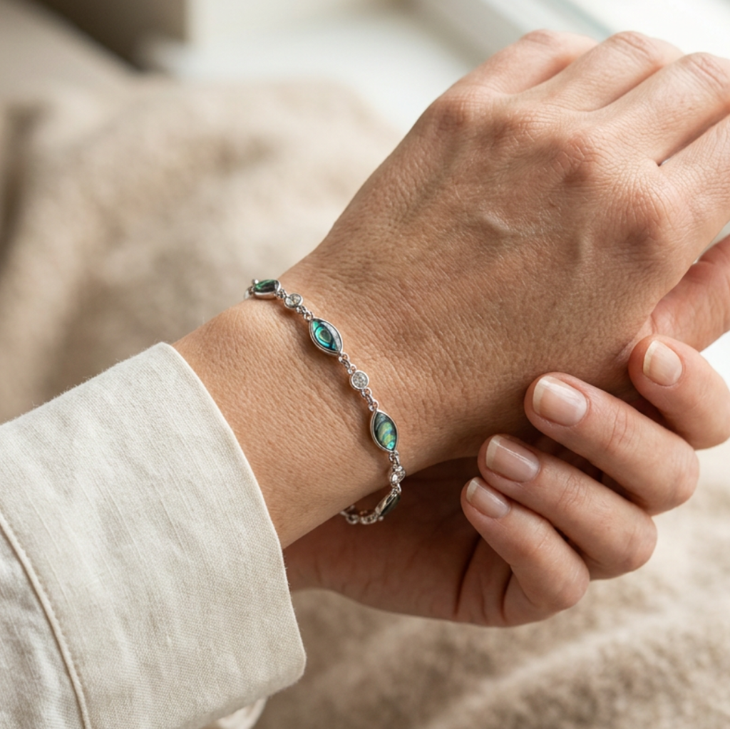Woman wearing the Paua shell and glass-stone bracelet