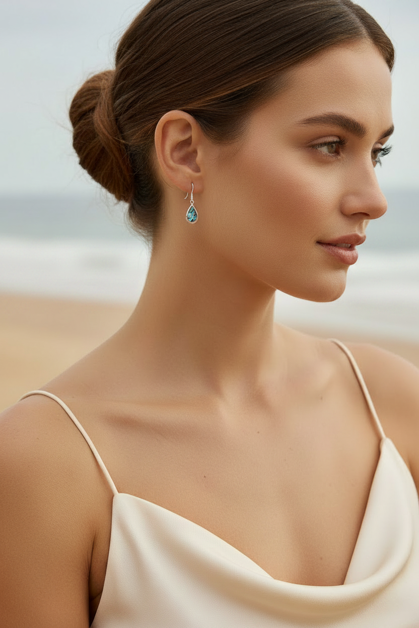 Woman Wearing Tiny Paua Shell Teardrop Earrings